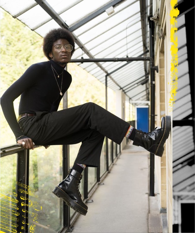 MAN WEARING PATENT LEATHER DOCS